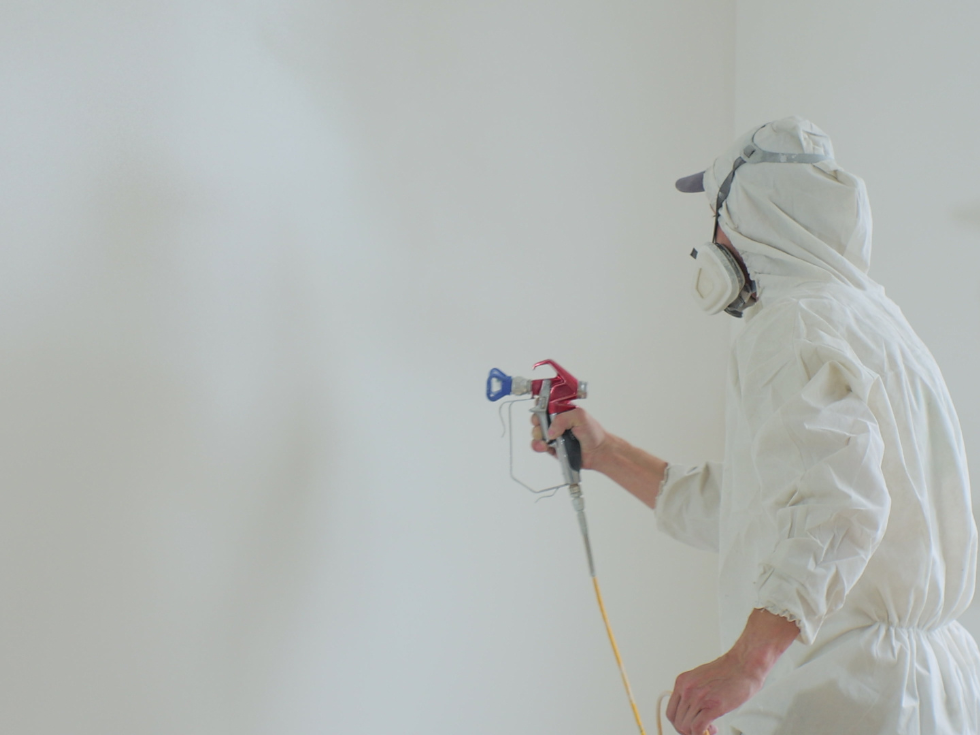 Spray Painting White Colour On A Wall - Asian Paints