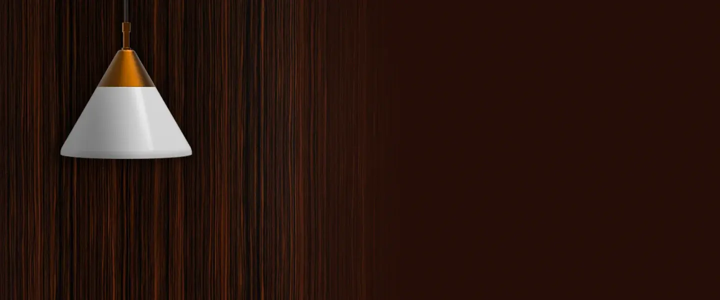 A pendant light beneath a wall in wooden  finish.