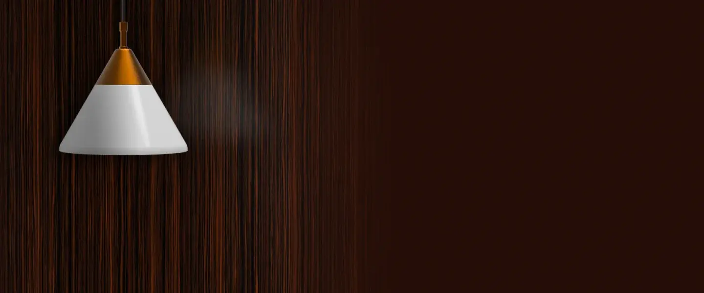 A pendant light beneath a wall in wooden  finish.