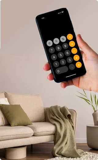 A sofa and a hand showing phone calculator