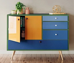 A console with cupboard and drawer storage in various shades of blue. Wood paint contractor by Asian Paints.