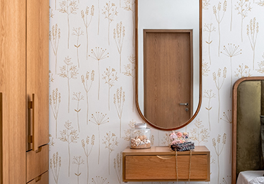 A Bedroom Design with an Oval Mirror