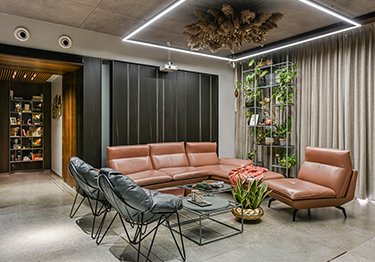 Chic Living Room with Contemporary Sitting Area and Indoor Greenery
