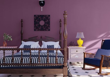 Rustic Bedroom with Deep Purple Wall
