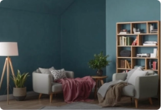 A modern living room featuring teal walls, comfortable seating, and a bookshelf. Find trusted painting contractors by Asian Paints.