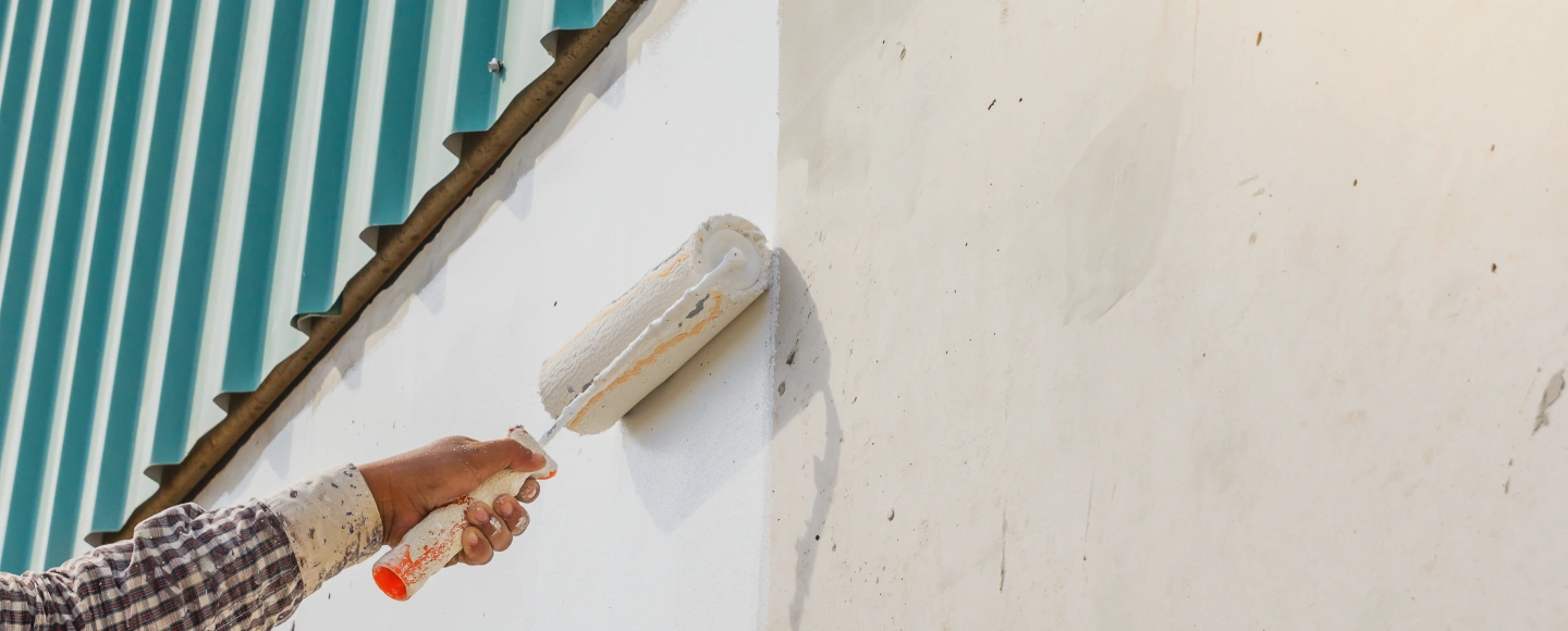 A wall being painted with a roller brush